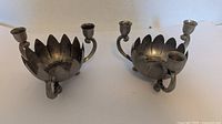 Front view of both lotus metal candle holders