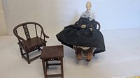 Full set showing doll seated on chair with second chair and side table