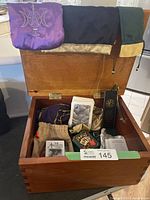 Chest open showing tarot decks, bags, bookmark