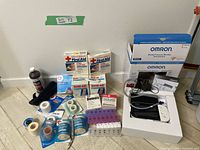 Lot overview showing all first aid items arranged on floor