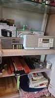 Both radios on shelf: Cambridge SoundWorks Model 88 and Sony ICF-7600D