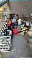 Group view of assorted pots, stands, stool, crate