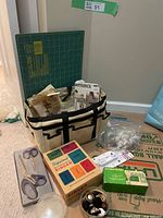 Entire lot showing tote, mat, boxes, scissors, patterns, notions