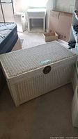 White wicker trunk closed