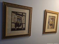 Two framed Chuck Hiddleston prints on wall showing frames and artwork