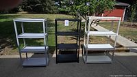 group shot of three shelving units showing colors and overall condition