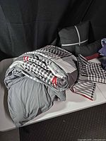 Grey reversible plaid set with decorative pillows