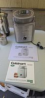 Cuisinart ice cream maker, manuals, part of percolator visible