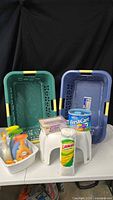 Overall lot view: two baskets, step stool, sprays, mop refill, dry-clean kits