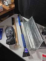 Snow brushes, ice scrapers, glove, windshield sunshade