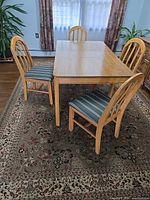 table, four chairs, rug overview
