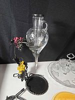 Wine aerator decanter on wrought iron stand with grape motif