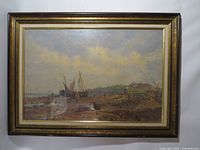 Front view of framed watercolor depicting coastal scene