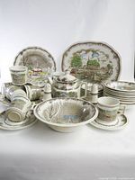 Full set showing platters, plates, bowls, mugs, teapot, shakers