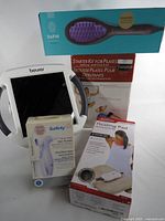 Group shot of all five boxed items and Beurer lamp