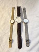 Three Skagen watches laid out side by side