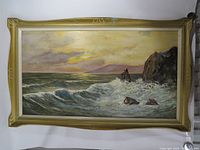 Front view of framed seascape painting