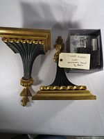 Pair of wall sconces and boxed Eden fragrance lamp overview