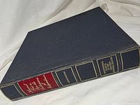 Closed blue presentation binder spine view