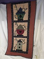 Full view of quilted birdhouse wall hanging front