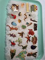 Entire lot on tray showing all enamel pins