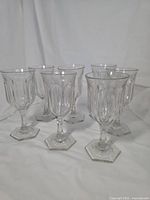 All seven facet-cut glass goblets grouped