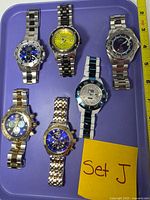 Front view of all six Invicta watches showing dial designs and finishes