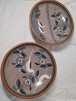 Top view of both painted ceramic bowls showing design and rims