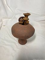 Front view showing entire mushroom-form pottery piece
