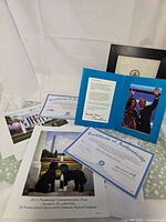 Group of prints, COAs and presentation folder