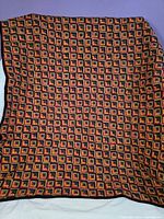 Full view of quilt showing overall Log Cabin block pattern