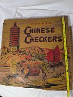 Front of worn box showing artwork and tape for scale