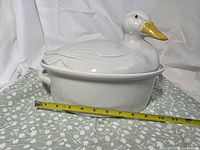 Profile view of duck casserole with tape showing length around 13 in