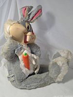 Front view of plush showing overall design, vinyl face, carrot, Mattel tag