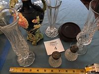 Group shot showing all vases, shakers and wooden stand with measuring tape for scale
