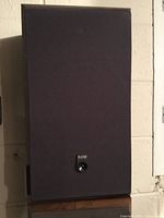 Front view of B&W speaker showing logo and grill