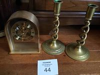 Front view of Sunbeam clock and both brass candlesticks