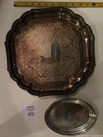Overview of both trays showing size reference and tarnish
