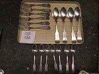 Overview of all 17 sterling utensils on tray