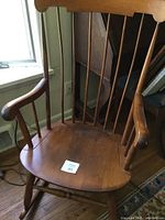 Front view of entire wooden rocking chair