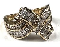 Front view of 14kt yellow gold ring with baguette CZ accents