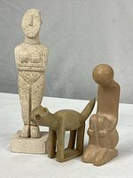 Group view of three abstract figurines