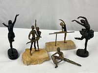 Group shot of all five ballet dancer figurines