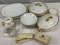 Entire lot showing platters, covered dishes, bowls, creamer, sugar, saucers and crumb sweeper