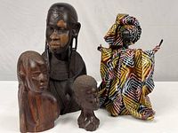 Group shot of all four sculptures showing relative sizes and materials