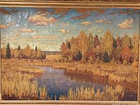 front view of framed autumn landscape painting