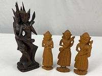 Group of four wood carvings