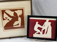 Both framed prints side by side