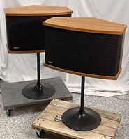 Full view of both Bose 901 speakers on stands