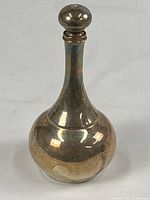 Full view of decanter showing shape and tarnish